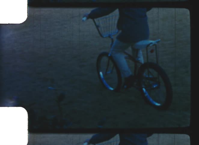 A child riding a bicycle outdoors