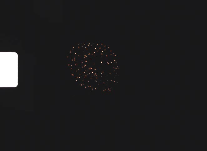 The fireworks shoot high into the night sky