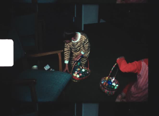 Young children take part in indoor easter egg hunt with colorful baskets