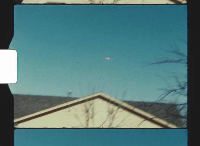 Boy playing with a remotecontrolled toy airplane outdoors