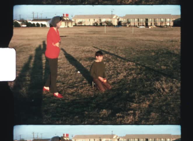 A mother and two kids outdoors on a sunny day