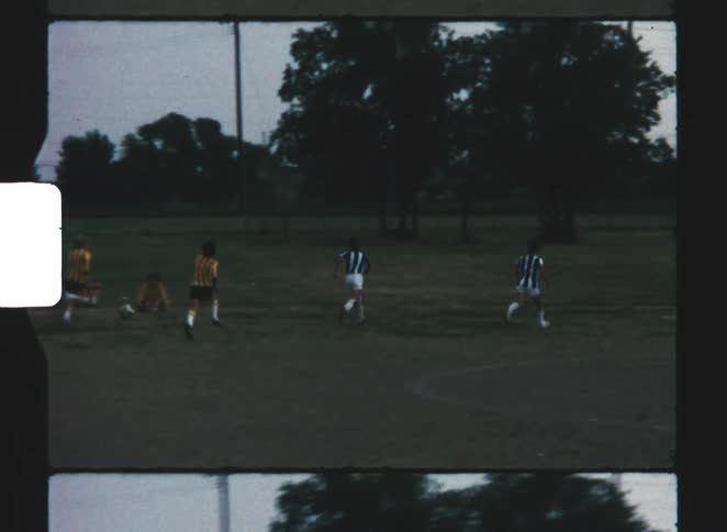 A group of kids playing soccer