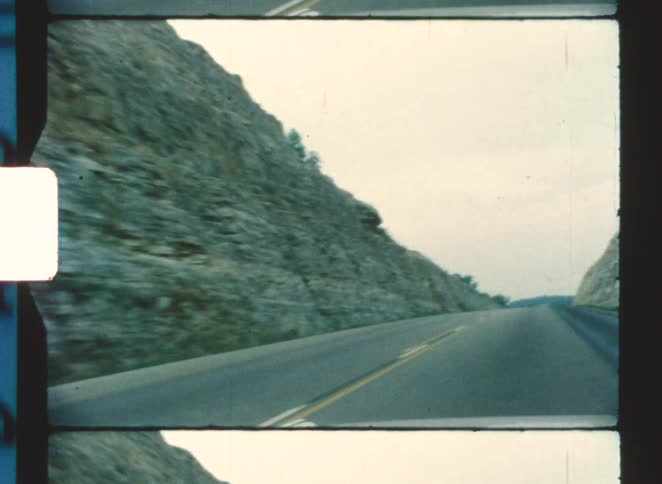 A view of a road cut through a canyon