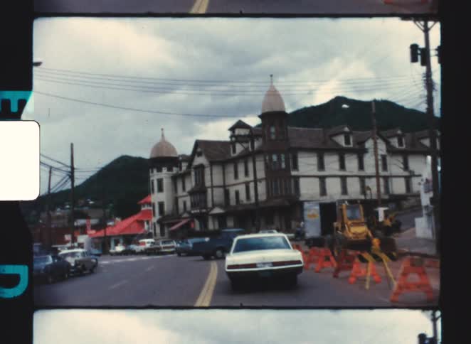 manitou springs 1970 colorado A group of cars driving through a small city