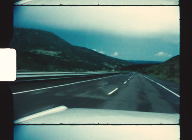 The car travels on the highway on a foggy day