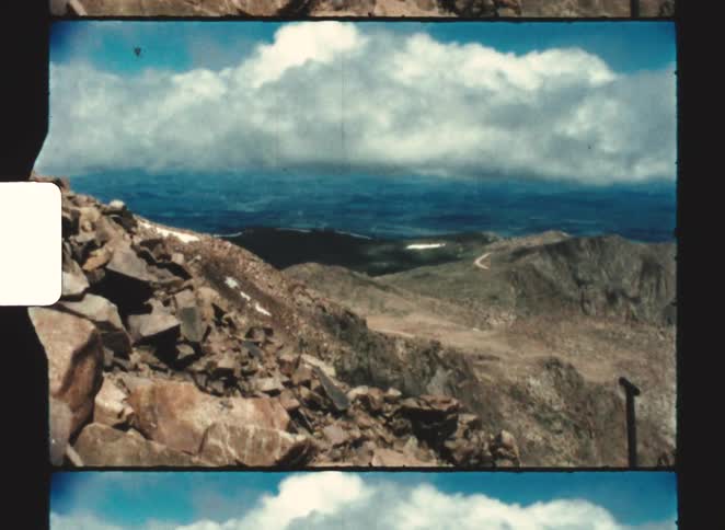 A group of people at the top of a mountain