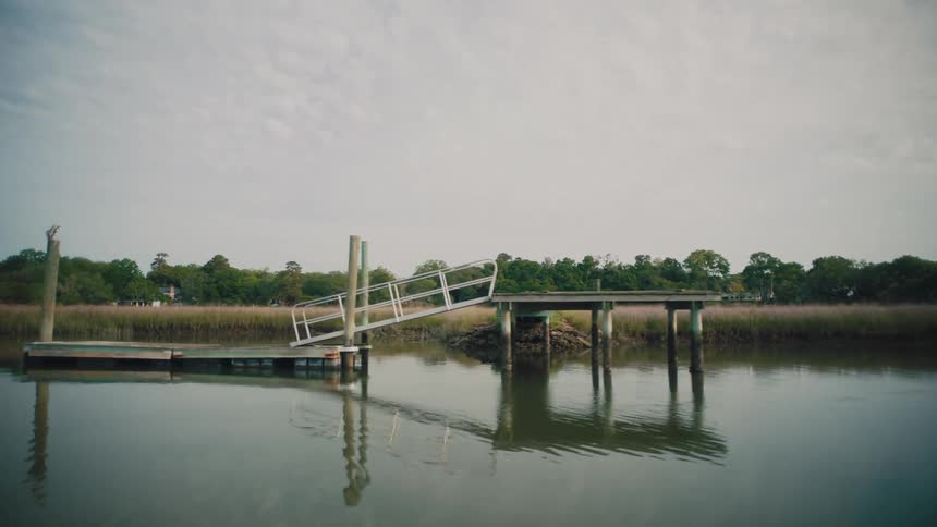 A boat dock is by the river bed