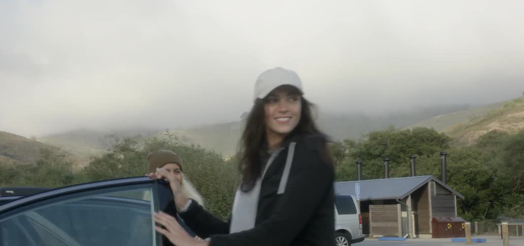 Women get out of a car