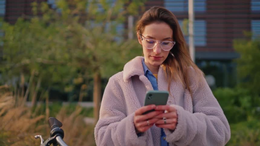 A woman using a smartphone outdoors