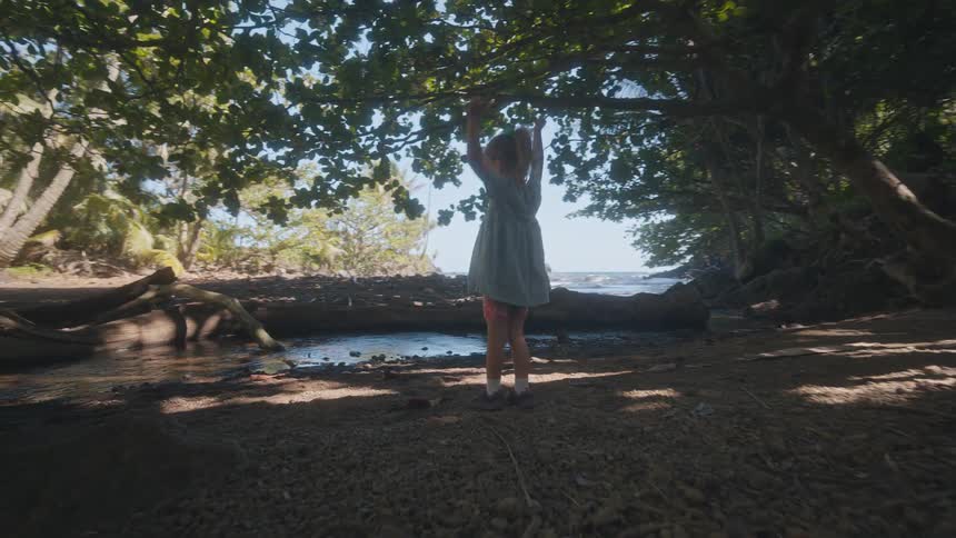 A child playing out near a river