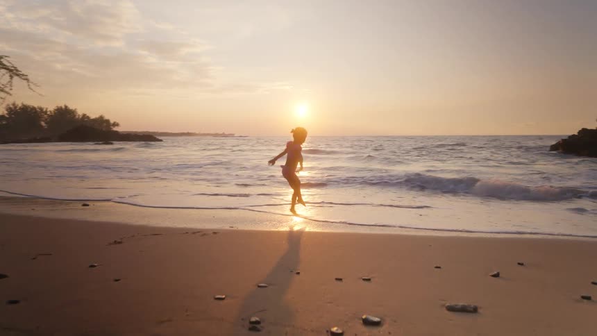 A child playing on the beach