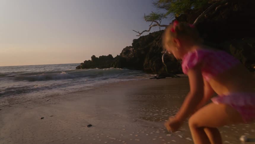 A child playing on the beach