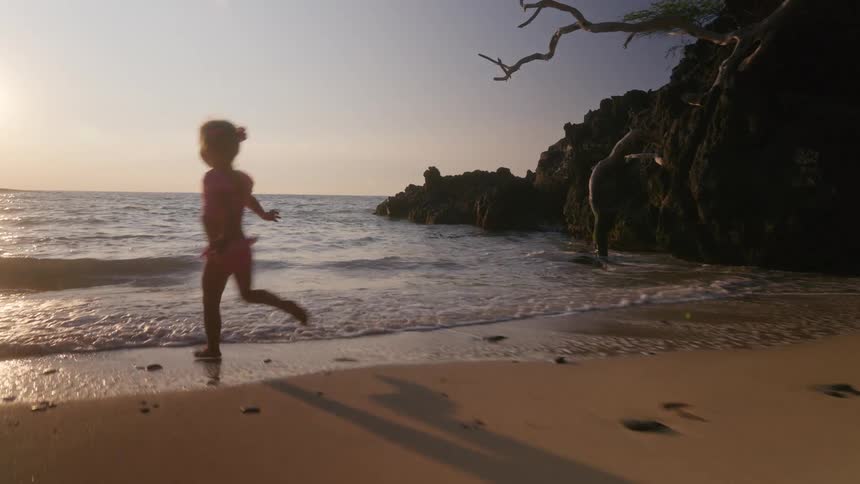 A child running at the beach
