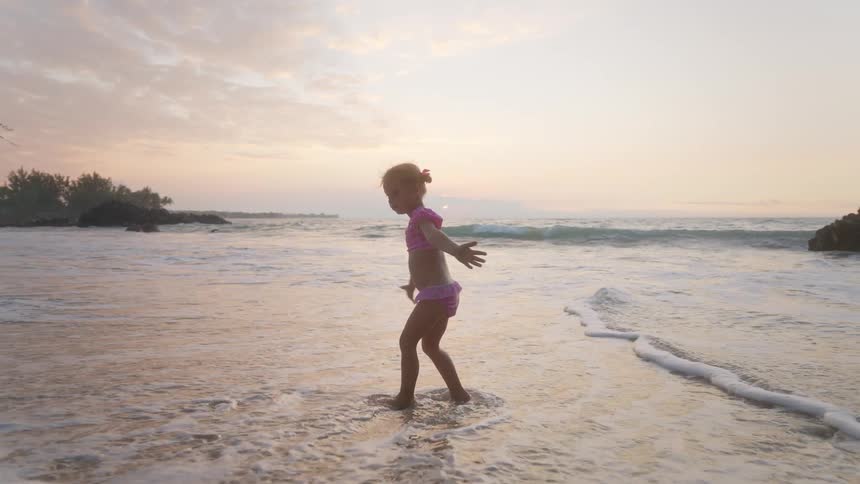 A child playing at the beach