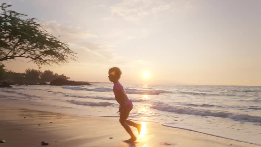 A child playing on a beach