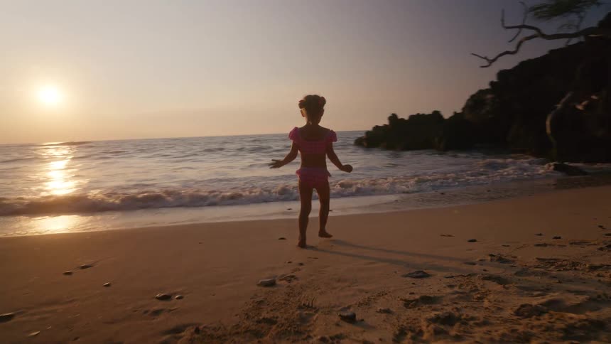A child playing at the beach