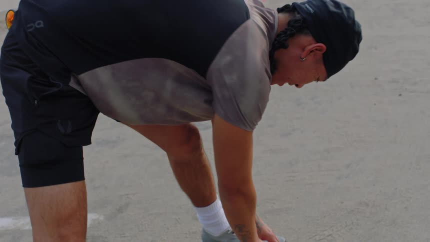Man outdoors stretching his body