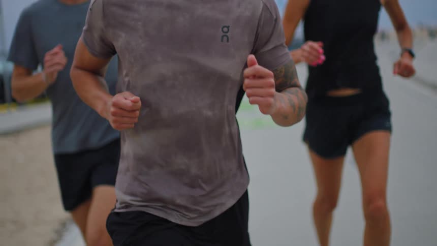 Three people are jogging together