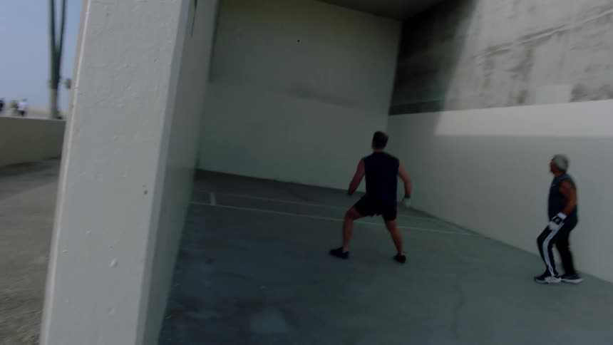 Two men playing handball