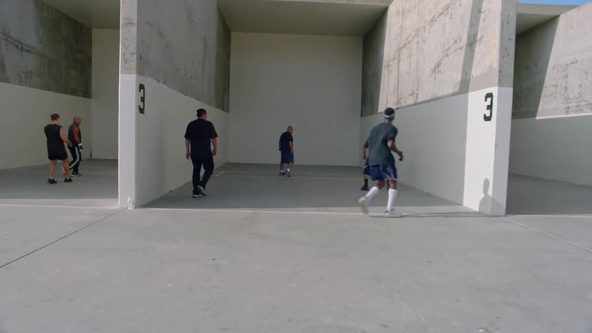 A group of people playing hand ball