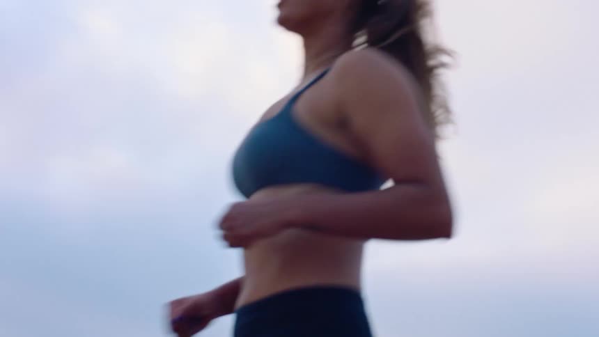 A woman outdoors playing volleyball