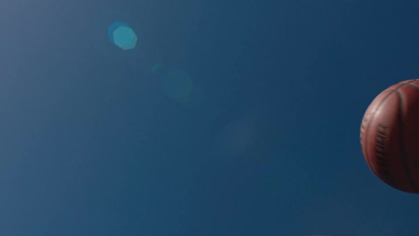 Person throwing a basketball