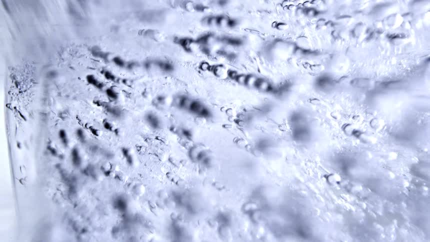 Translucent ice with aligned bubbles and internal textures seen in closeup