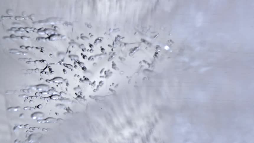 Translucent ice with bubbles and internal fissures seen in closeup