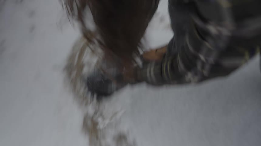 Two people having fun playing in the snow