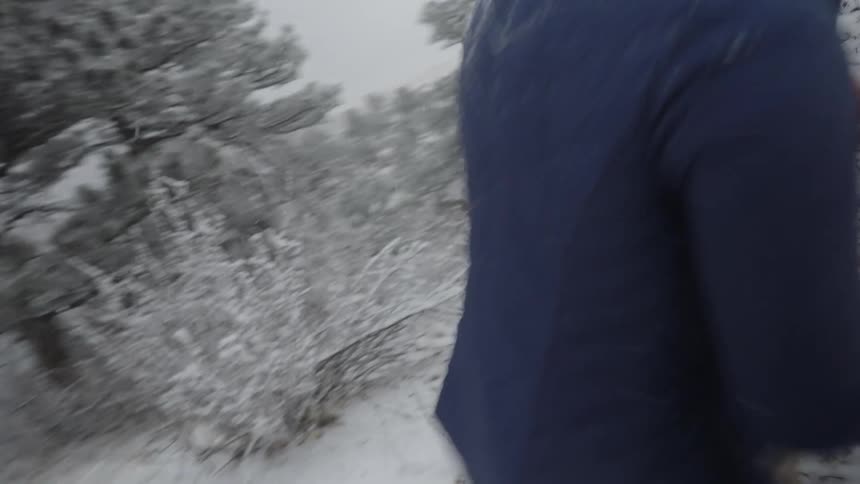 Man and woman playing in the snow