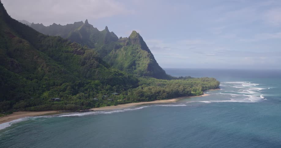 The mountains are covered with trees on the shore