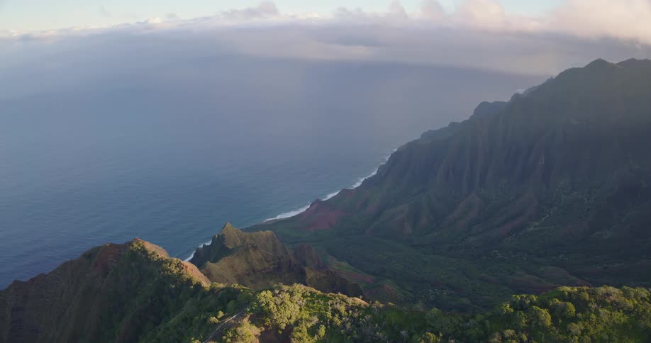 Coastal slope with steep cliffs and dense vegetation