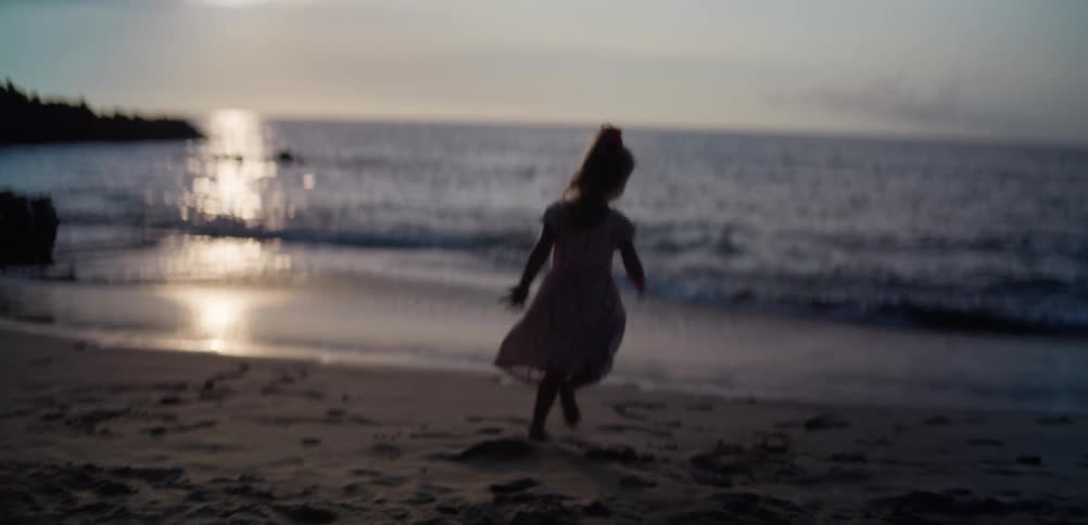 A child playing at the beach