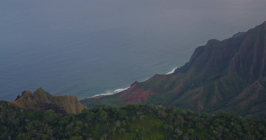 The ocean covers the landscape from the peak of the mountain