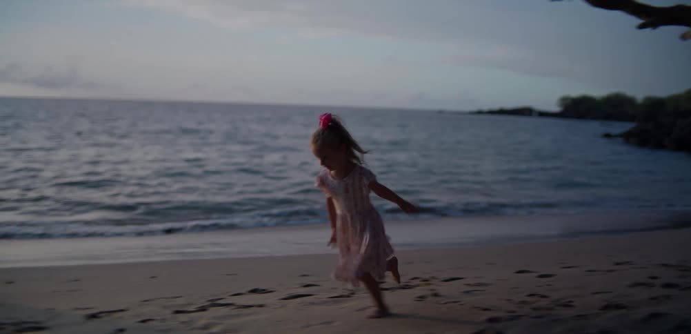 A mother and daughter playing on a beach
