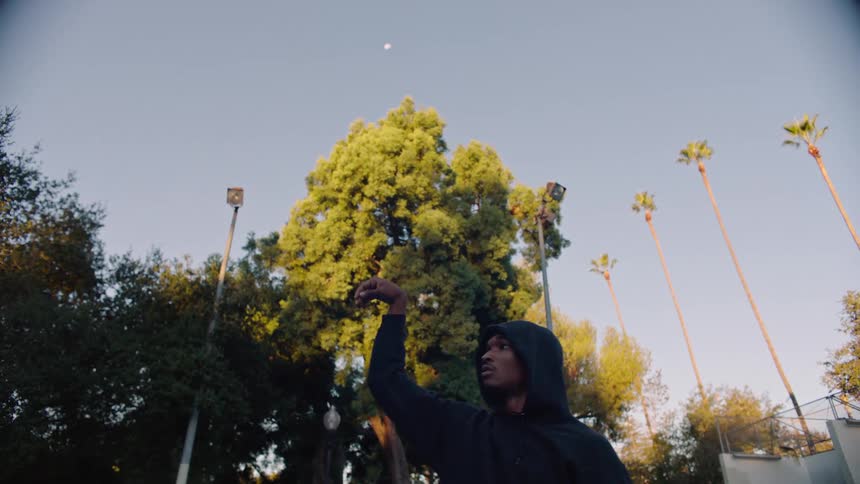 A man shooting a basketball