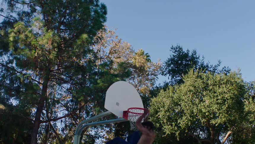 A man dunking a basketball