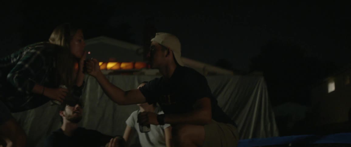 People pass a joint around outside