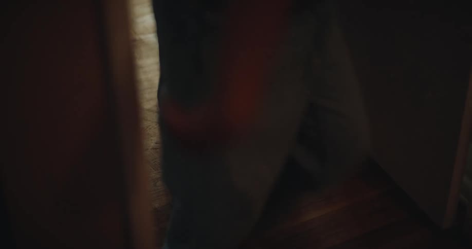 Two people walking down a hallway