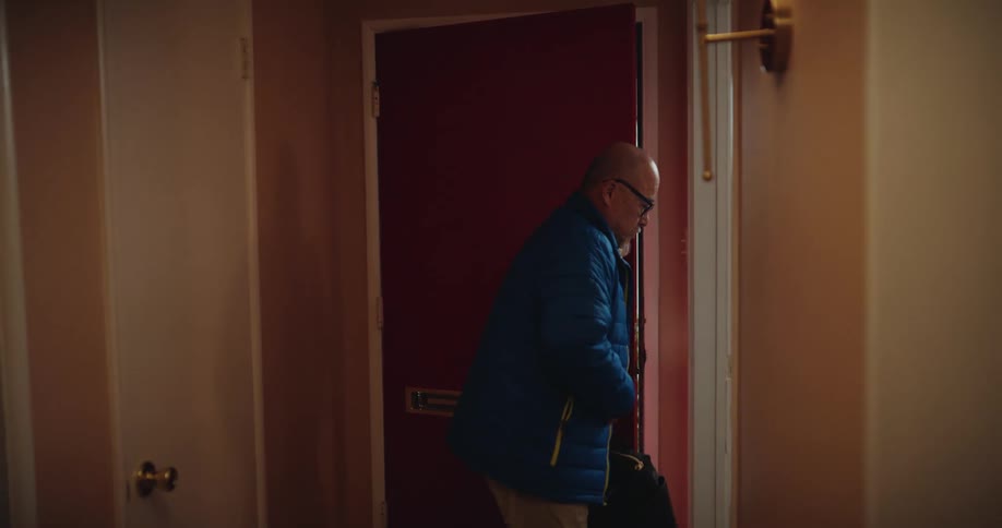 A man walking around in a room