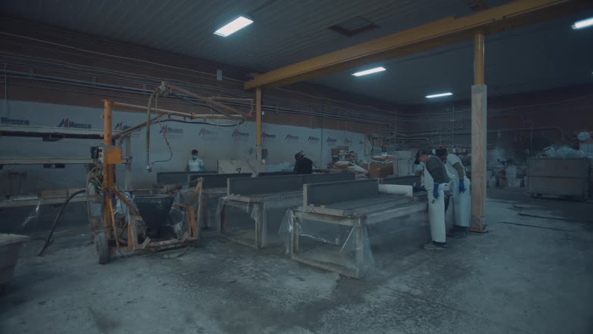 People working inside a factory
