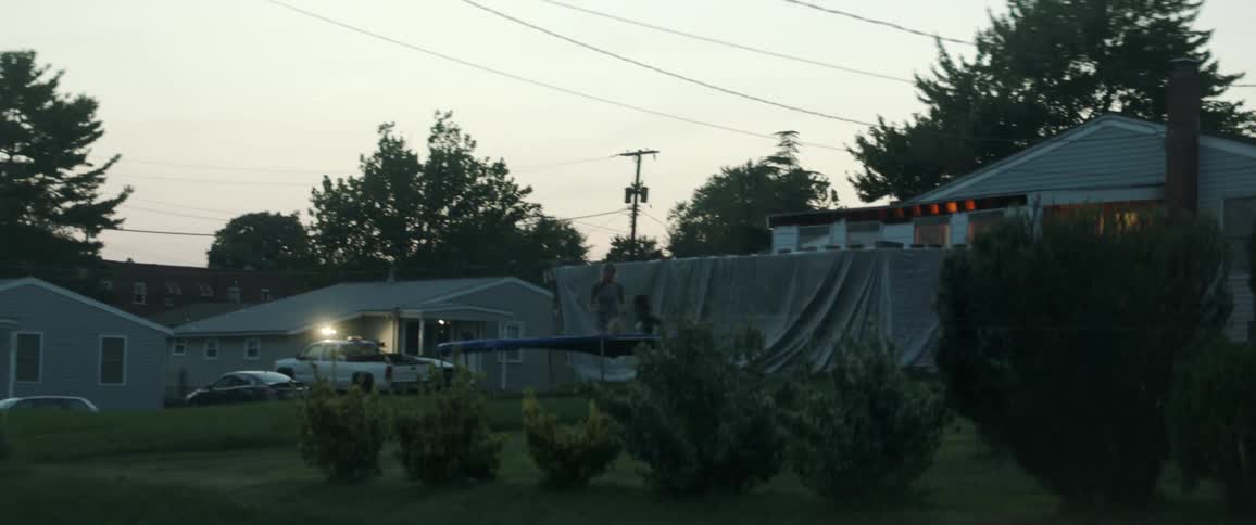 A couple plays on a trampoline