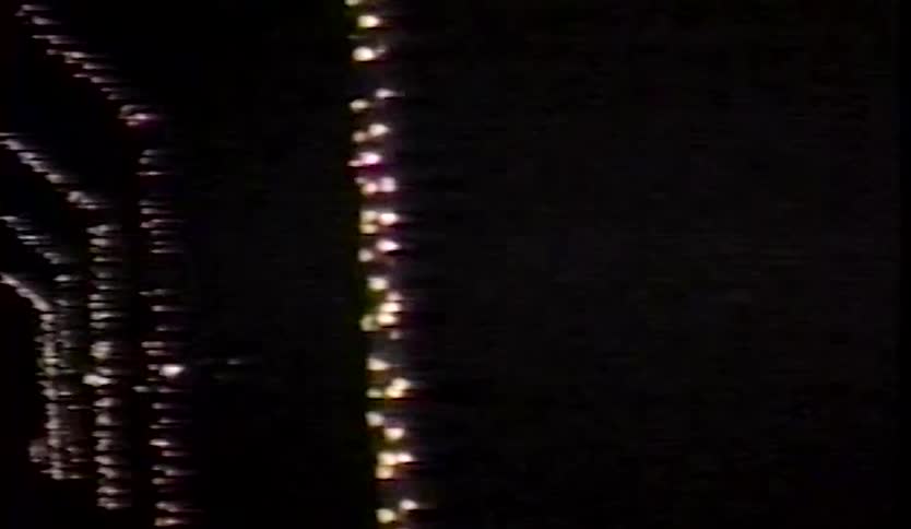 Christmas decorations in an outdoor area at night