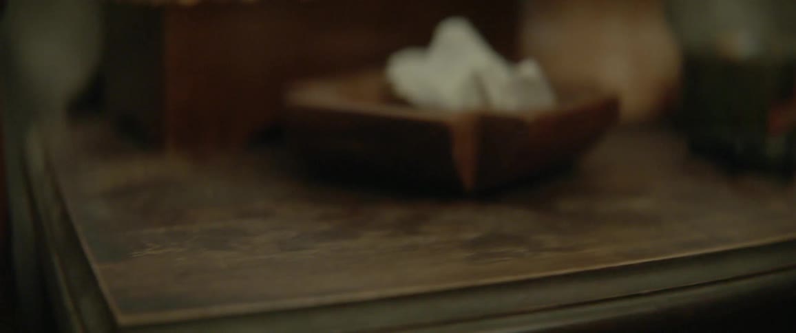 Person grabs a lighter off a table