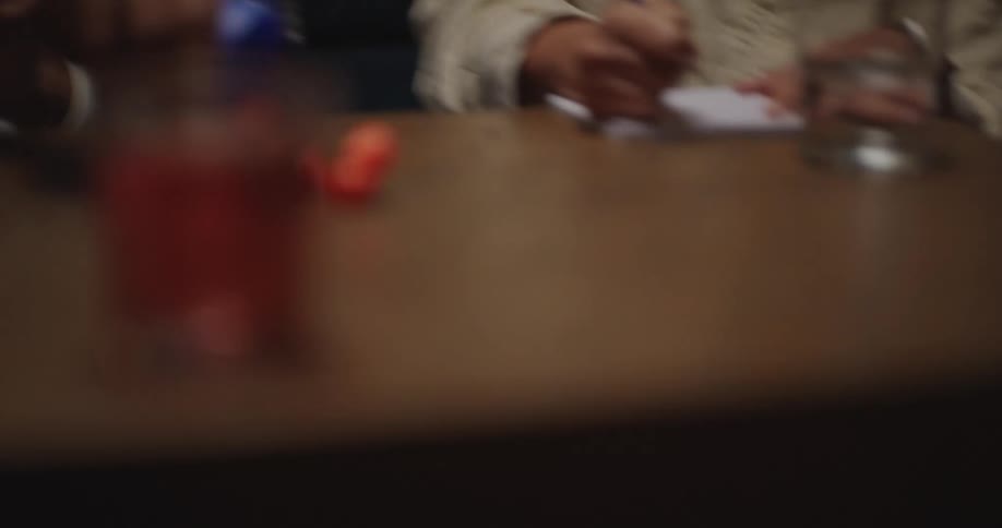 Man shaking his head and rolling dice