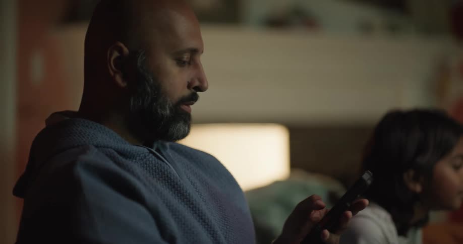A father and daughter playing video games