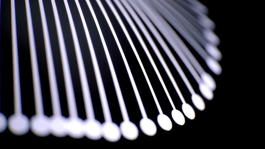 Some metal pieces hanging off a lamp