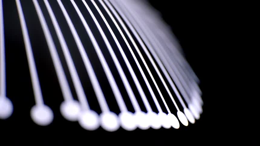 Parallel luminous lines form an abstract pattern against a dark background