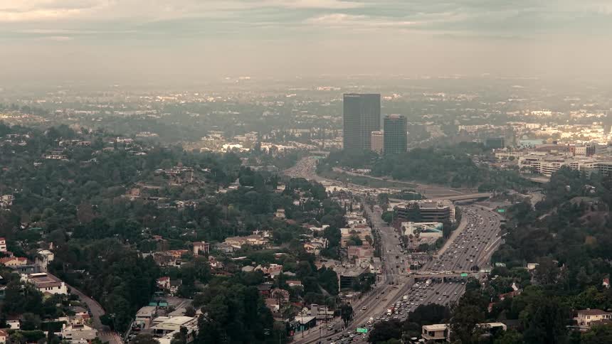 The traffic is flowing on the large freeway