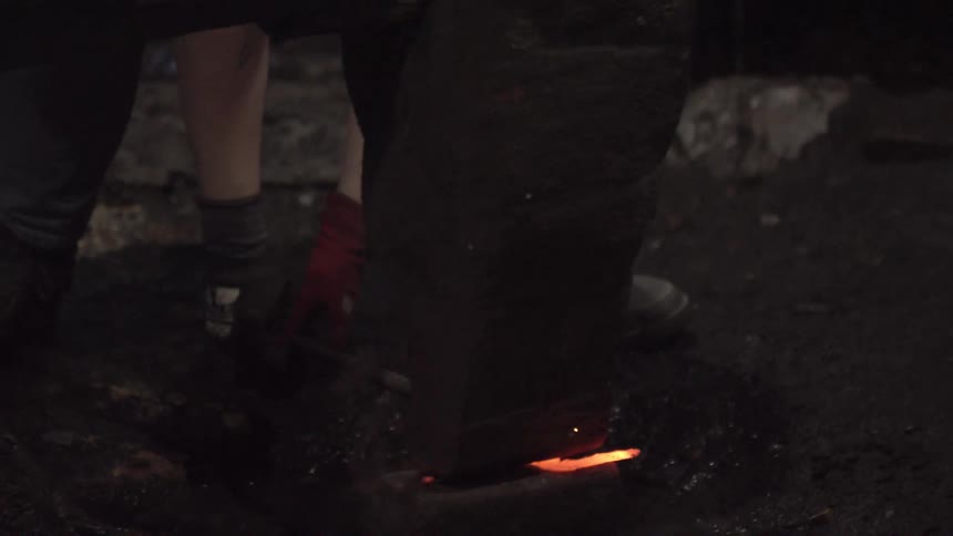 Hot iron being forged